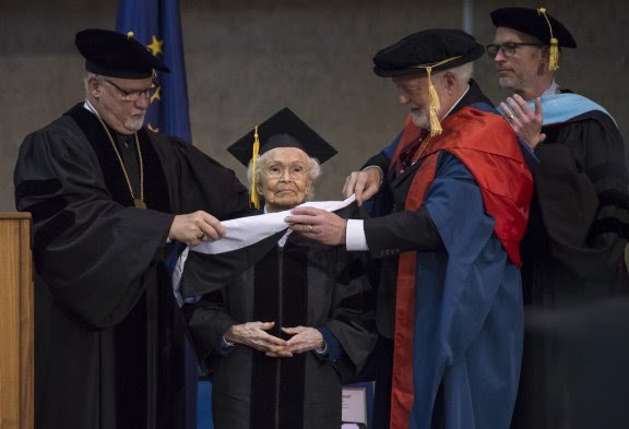 Marie receiving an honorary doctorate of humane letters from UAS, May 2018. (Michael Penn)