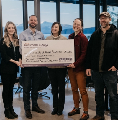 Representatives from Coeur Alaska presenting a check to UAS at the Áakʼw Tá Hít building for Environmental Science. From left: Rochelle Lindley, External Affairs Manager (Coeur Alaska); Chris Natynski, Executive Director of Advancement (UAS); Dr. Alison Staudinger, Interim Dean of Arts & Sciences (UAS); Dr. Megan Behnke, Assistant Professor of Chemistry (UAS); and Pete Strow, Environmental Manager (Coeur Alaska). 