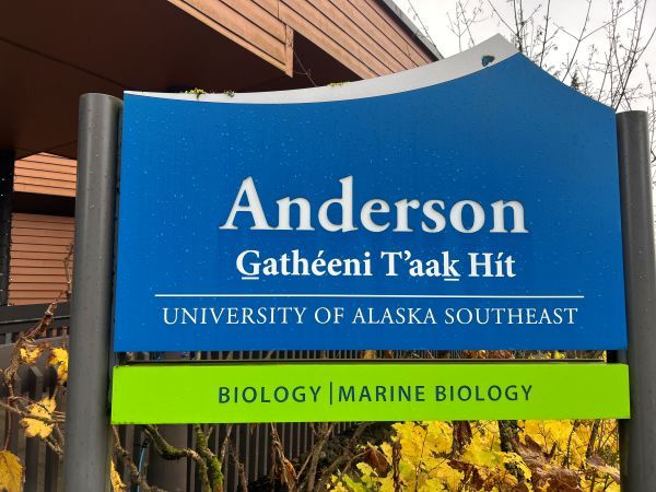 The sign in front of the Anderson Building, G̱athéeni Tʼaaḵ Hít.