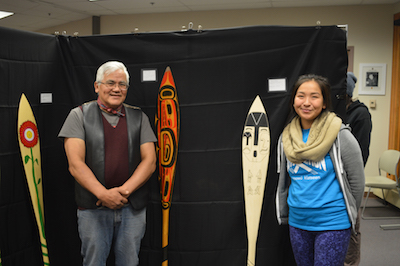 Wayne Price and student Kaytlynne Lewis pose with their paddles (credit: Davina Cole)