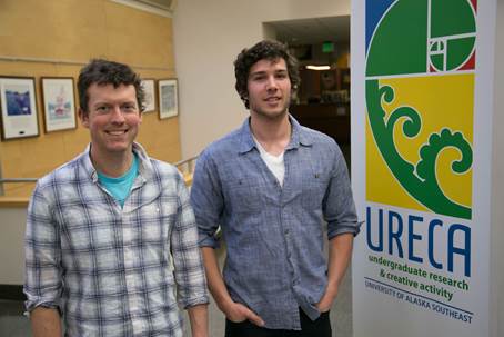 UAS Student Avery Stewart,  a Coeur Alaska - Kensington Gold Mine Environmental Science Award recipient, right, stands with his mentor Asst. Professor of Forest Ecosystem Ecology Brian Buma, Ph.D. in the Egan building at the Juneau campus Wednesday, Jan. 25, 2017 (photo credit: Seanna O'Sullivan)