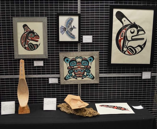 Collection of prints and carved items in the Northwest Coast style