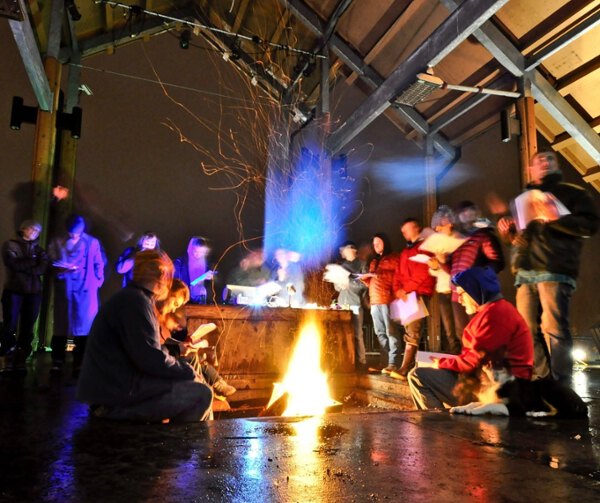 Students gathered around a fire