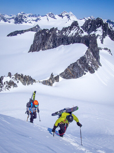 Two mountaineers on the ridge with skis
