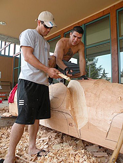 Brothers Joe and T.J. Young carving Eagle totem