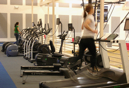 Exercise equipment positioned on inside of running track