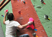 Climber on the textured UAS climbing wall