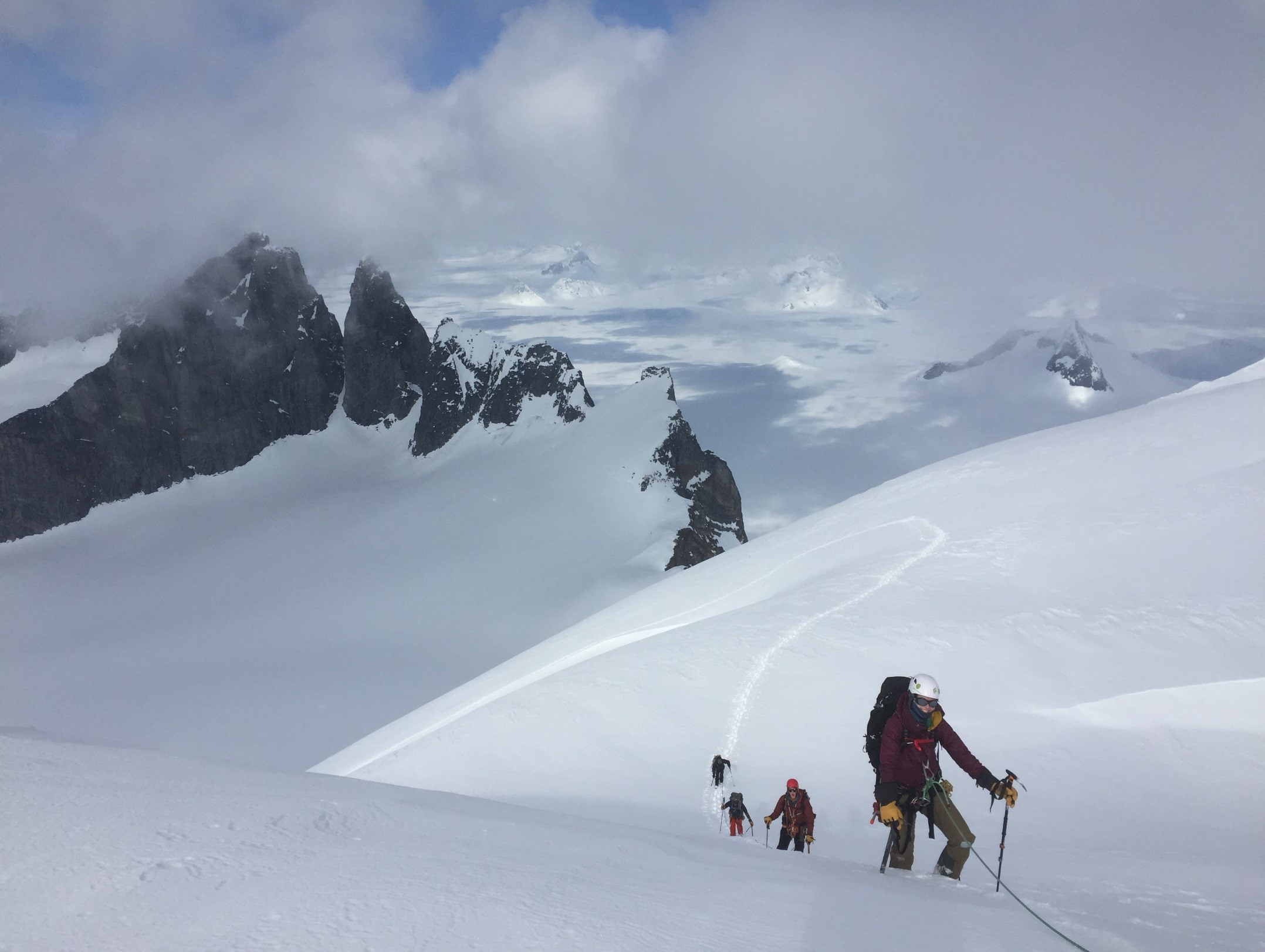 Katie McCaffrey approaches the Summit of Emperor Peak on April 15, the Taku Towers are behind.